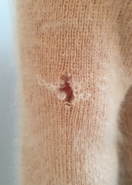 Tattoo in a peach sweater 