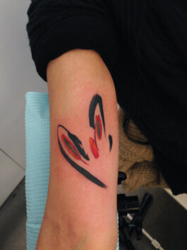 Abstract tattoo shapes on arm 