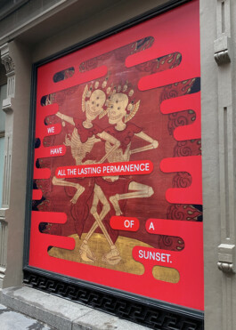 Red sign with dancing skeletons