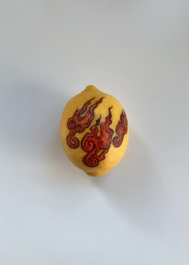 Flames tattooed on a lemon