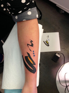 Black abstract tattoo forearm 