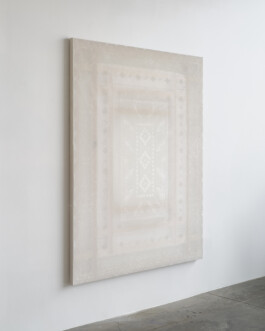 Transluscent white painting on a wall 