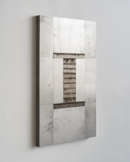 Shiny steel sculpture with fingerprints 